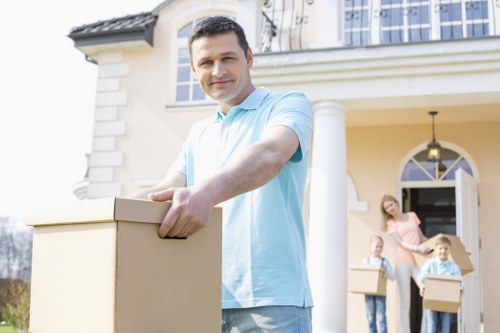 Local office moving team handling furniture and equipment