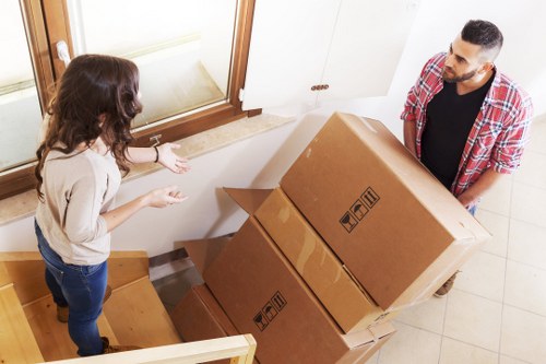 Loading furniture and boxes into a van near Tottenham Green