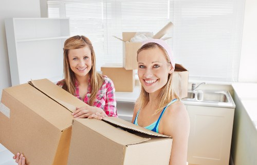 Packed boxes and furniture ready for removal truck transport