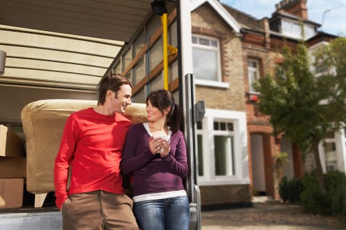 Careful loading of household items into a moving van