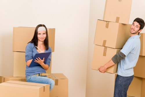 Professional house removals team handling furniture in Tottenham Green